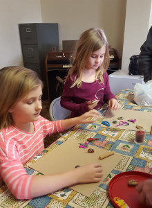 Izzy and Caroline creating polymer clay art.